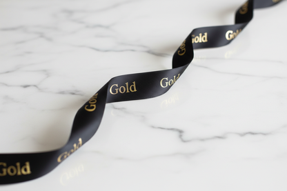 Black ribbon gold writing