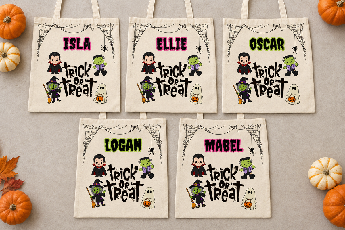 Five personalised trick or treat bags laid flat
