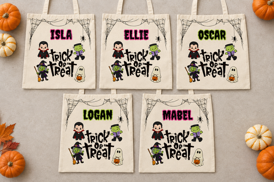 Five personalised trick or treat bags laid flat