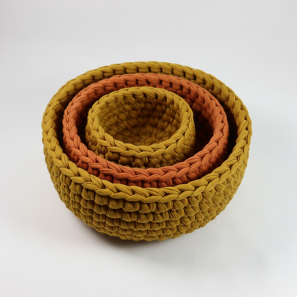 Crochet nesting bowls in mustard yellow and burnt orange